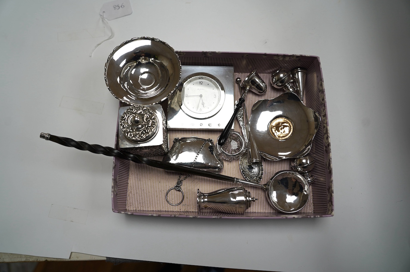 Sundry small silver including a late Victorian silver tea caddy (lid stuck), purse, tazza, modern timepiece, dish with inset coin, extinguisher, toddy ladle etc. and two plated items. Condition - poor to fair to good